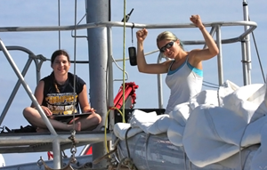 Kait Frasier (L) and Rachel Gottlieb (R) with Scripps Institution of Oceanography onboard the Ocean Alliance’s R/V Odyssey in the Gulf of Mexico celebrate after finding dolphins. (Photo provided by Frasier)