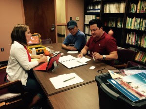 Heather Dippold (left- CONCORDE Education & Outreach) meets with Peter Nguyen ( right close- Mississippi State University Coastal Research and Extension Center) and Captain Nguyen (far right) to discuss data collection and the community meeting. Photo credit: Jessica Kastler