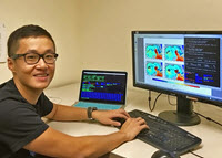 Shitao generates a visualization comparing satellite observational data to model simulations. (Photo by Suzhe Guan)