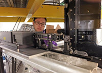 Xinzhi adjusts the laser optics for particle image velocimetry experiments. (Provided by Xinzhi Xue)